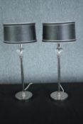 A pair of matching desk lamps. Each with a decorative glass bulbs at the stem. H.51 cm. (each).