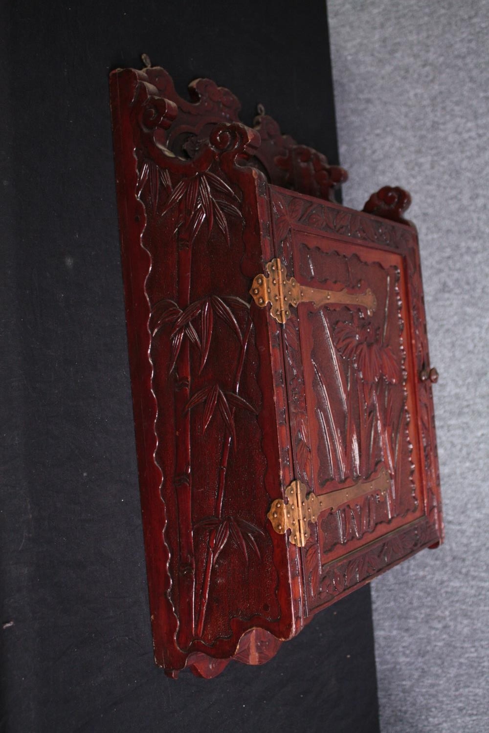 An Japanese carved wall mounted cabinet with Iris and Chrysanthemums. H.65 W.34 D.16cm. - Image 5 of 5