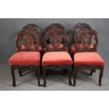 Dining chairs, a set of six Burmese carved hardwood.