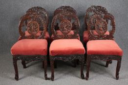 Dining chairs, a set of six Burmese carved hardwood.