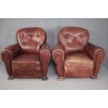 Armchairs, a pair mid century vintage in buttoned leather and studded upholstery. H.85 W.90cm. (