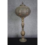 A brass Ottoman candlestick converted into a lamp. H.80cm.