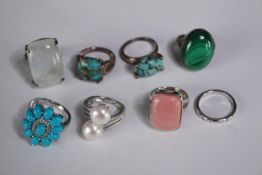 A collection of ten silver gem-set rings of various designs. Set with malachite, Turquoise, quartz