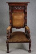 Throne chair, early 19th century carved oak with sabre lion's paw supports. H.149 W.76 D.74cm.