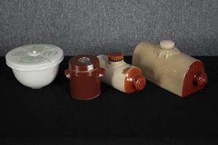 A ceramic pie dish and and stoneware hot water bottles. H.13 W.30cm. (largest)