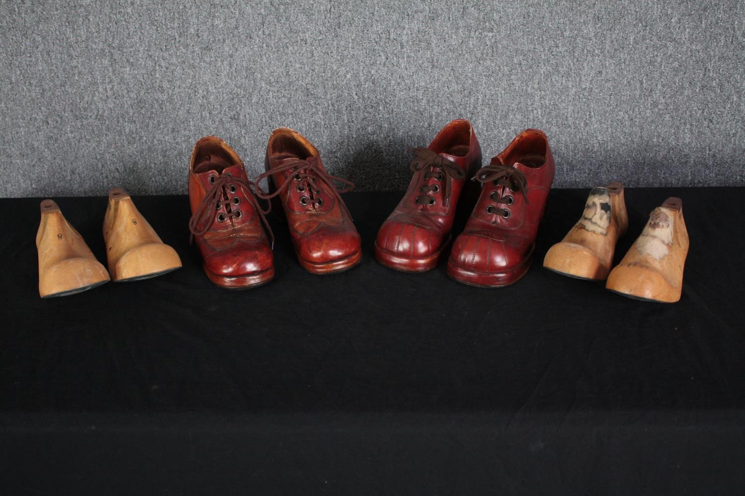 Anthony F. Richardson. Two pairs of 1970s platform high heeled shoes with their shoe trees made