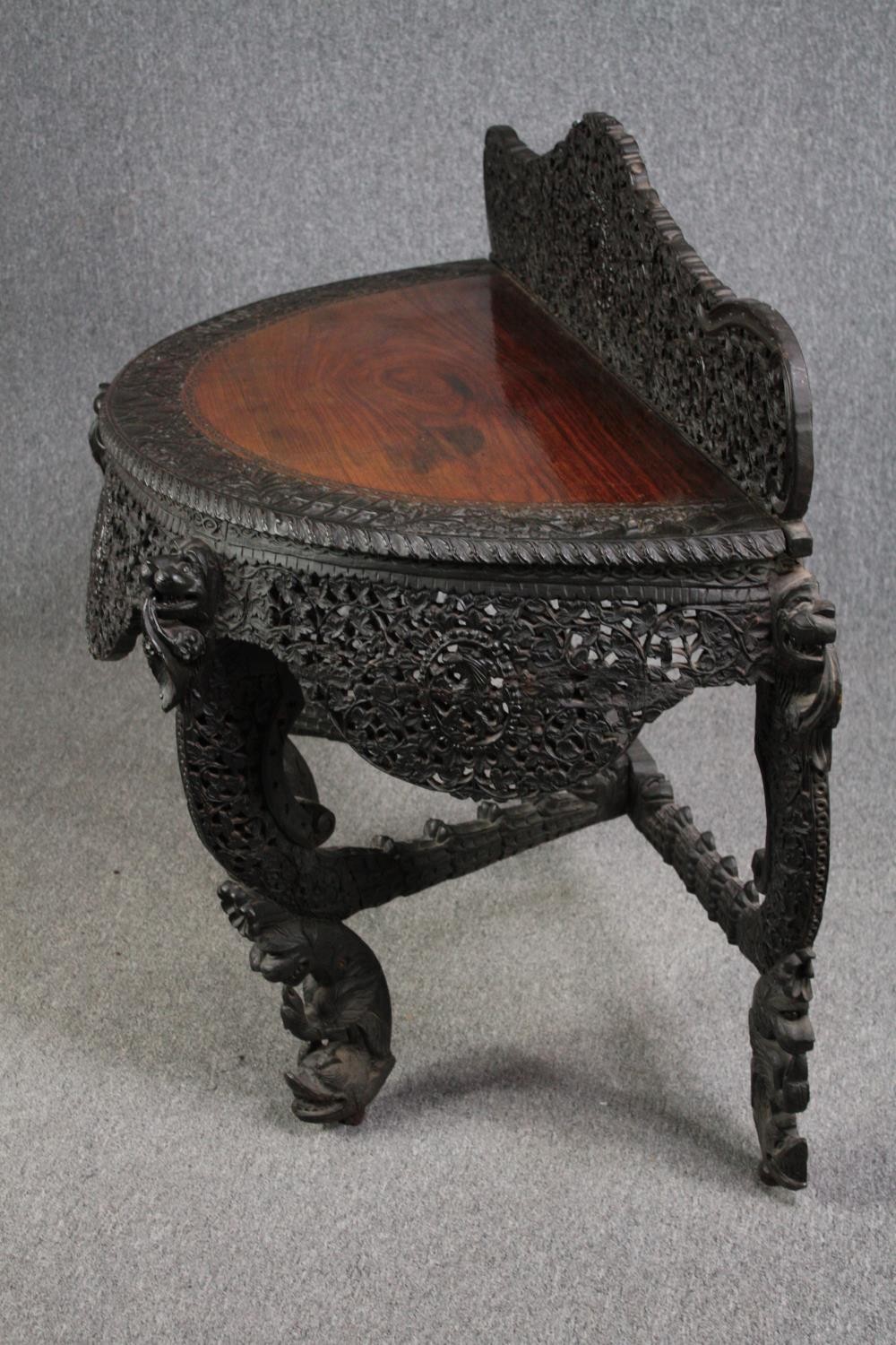 Console table, Burmese profusely carved hardwood. H.103 W.133 D.60cm. - Image 5 of 6