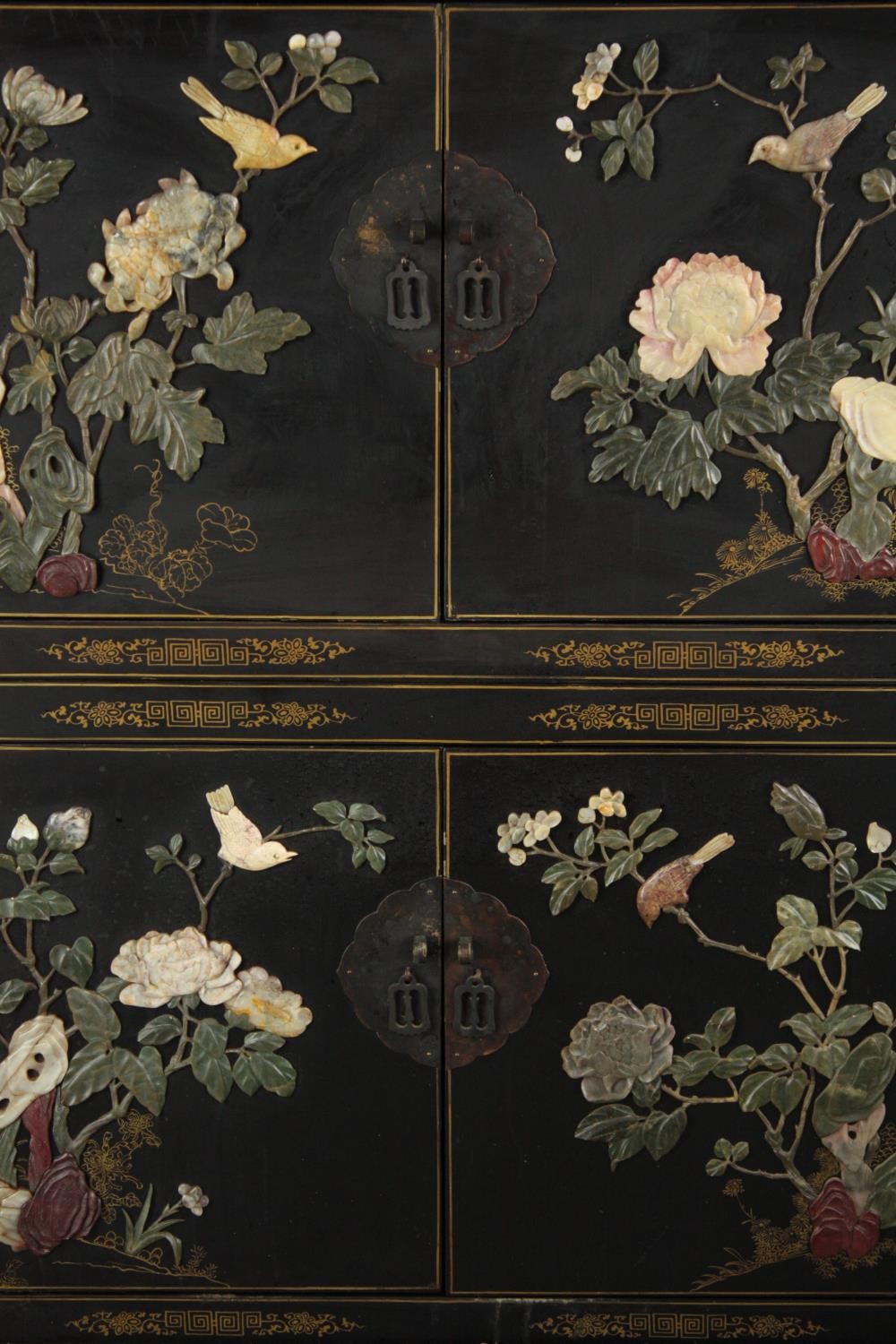 Cabinet, Chinese lacquered with allover applied decoration, in two sections. H.150 W.91 W.47cm. - Image 4 of 7