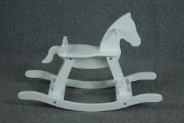A contemporary white lacquered Pinolino rocking horse. H.59 W.87 D.31cm.