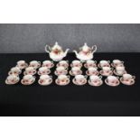 Royal Albert. Old Country Roses miniature tea set. Twenty-four matching cup and saucers and two