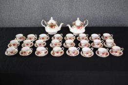 Royal Albert. Old Country Roses miniature tea set. Twenty-four matching cup and saucers and two
