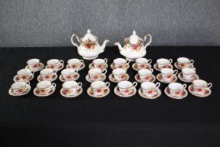 Royal Albert. Old Country Roses miniature tea set. Twenty-four matching cup and saucers and two