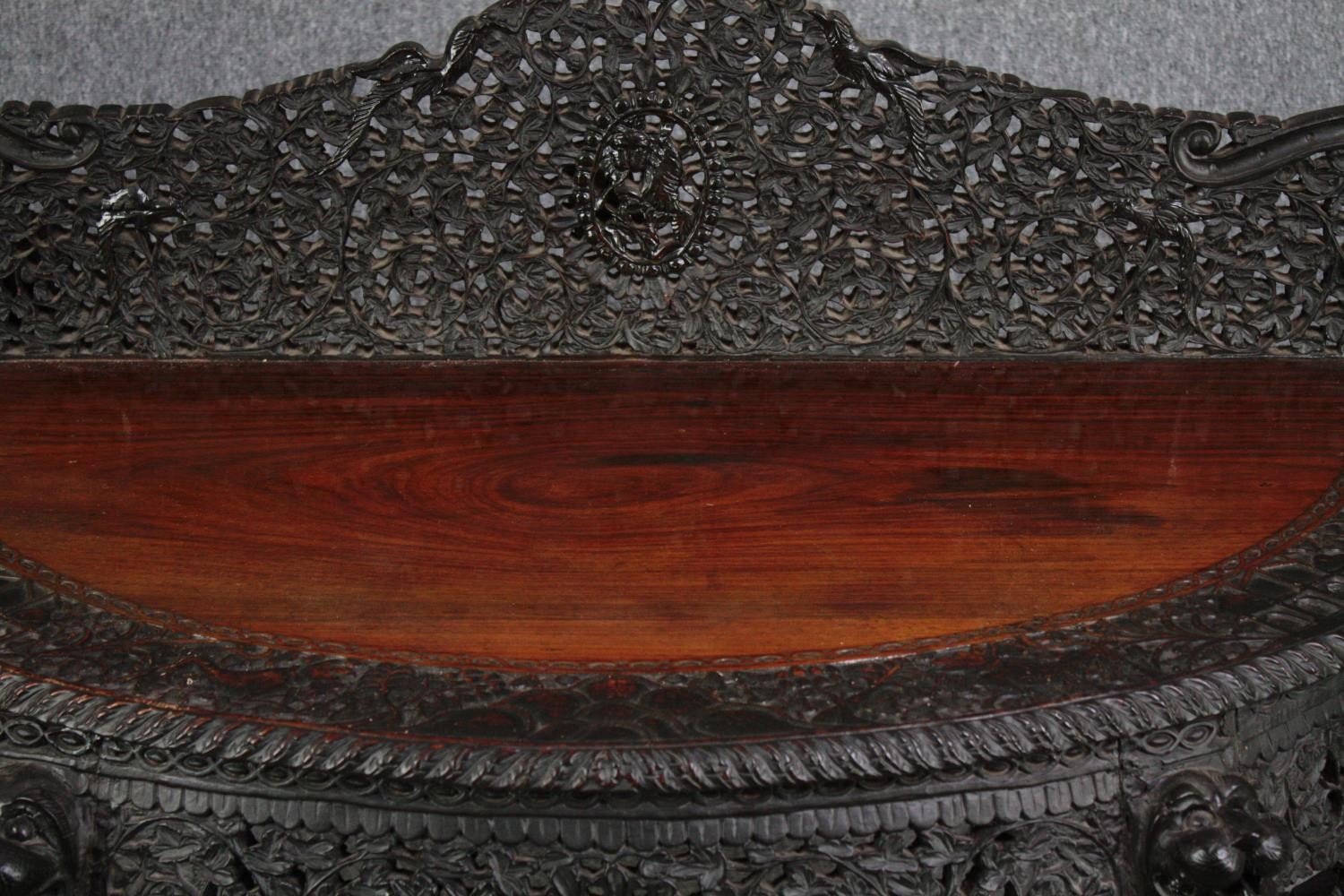 Console table, Burmese profusely carved hardwood. H.103 W.133 D.60cm. - Image 2 of 6