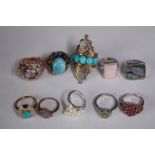 A collection of ten silver gem-set rings of various designs. Set with rose quartz, Turquoise,