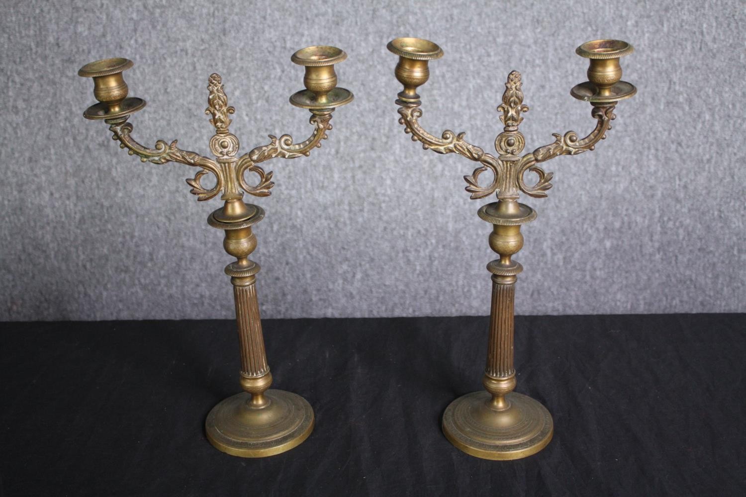 A pair of brass candle holders. Probably late nineteenth century. H.37cm. (each)