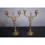 A pair of brass candle holders. Probably late nineteenth century. H.37cm. (each)