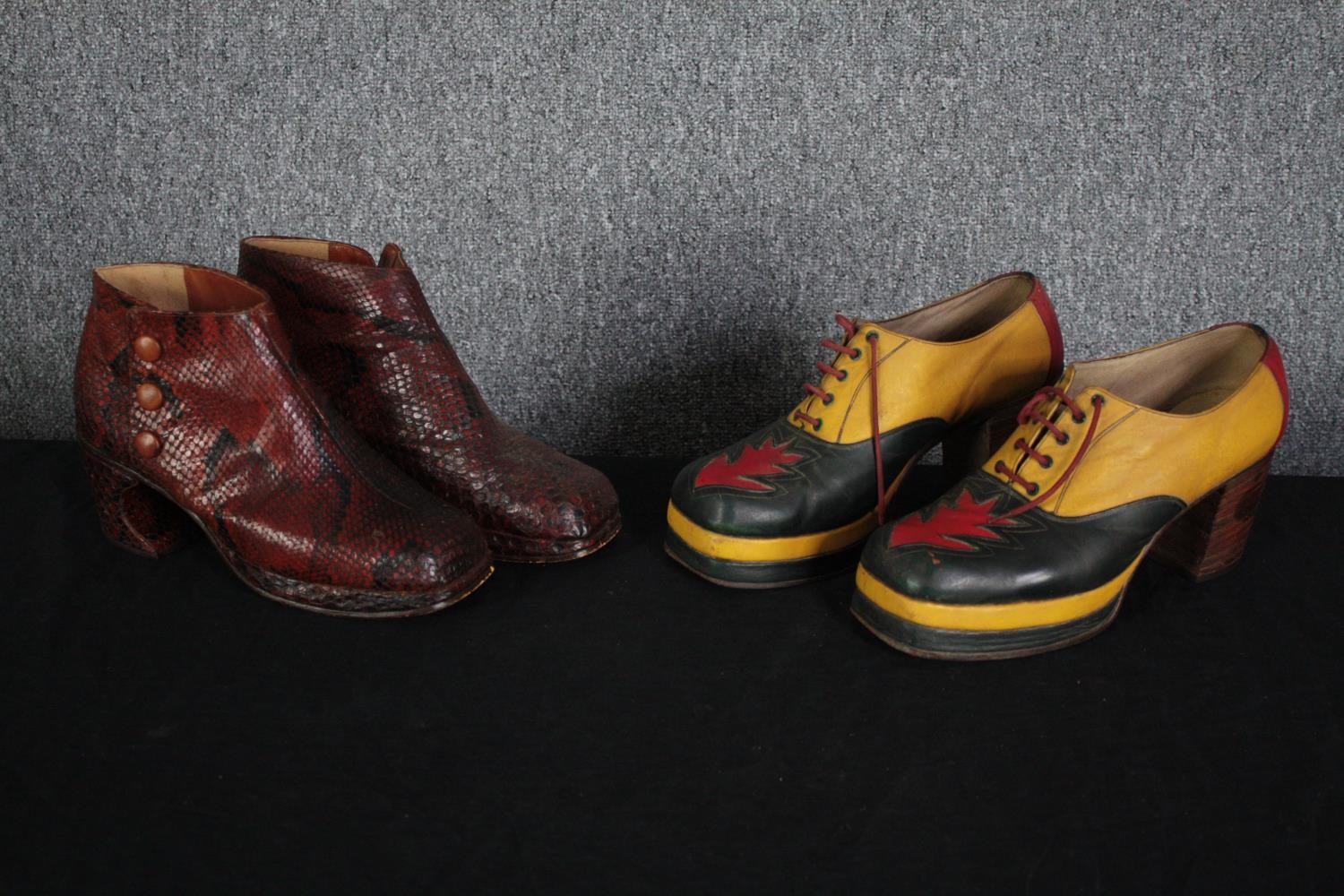 Two pairs of bespoke made platform high heeled shoes. Both size 9. Snakeskin boots and the other