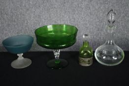 A collection of mixed glass including a decanter and two raised bowls. Also, a green Art Nouveau