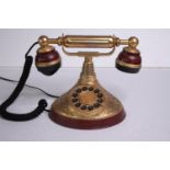 A modern reproduction of an old phone. H.18 W.25cm.