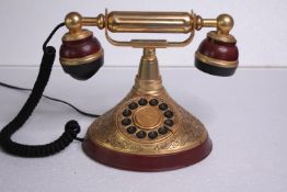 A modern reproduction of an old phone. H.18 W.25cm.