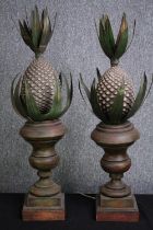 A pair of matching carved pineapple lamps. Metal sat on turned wooden stands and base. H.80cm. (
