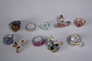 A collection of ten silver gem-set rings of various designs. Set with peridot, Turquoise and blue