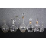 A mixed collection of six decanters all but one complete with their stoppers. H.30cm. (largest)