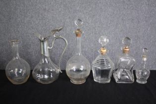 A mixed collection of six decanters all but one complete with their stoppers. H.30cm. (largest)