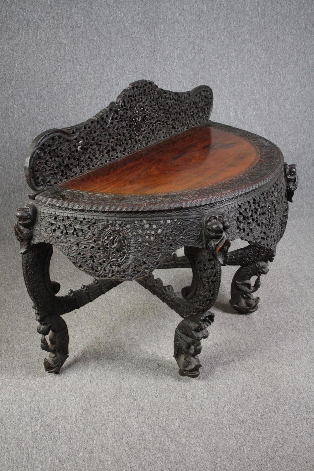 Console table, Burmese profusely carved hardwood. H.103 W.133 D.60cm. - Image 3 of 6