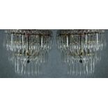 A pair of mirror backed crystal wall lights. Decorated with hanging teardrop glass. H.23 cm. (each)