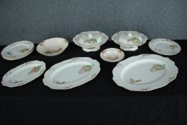A collection of Alfred Meakin 'Osiris' patter tureens, dinner plates and serving dishes and