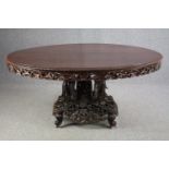 Breakfast or dining table, late 19th century or early 20th, Burmese profusely carved hardwood with