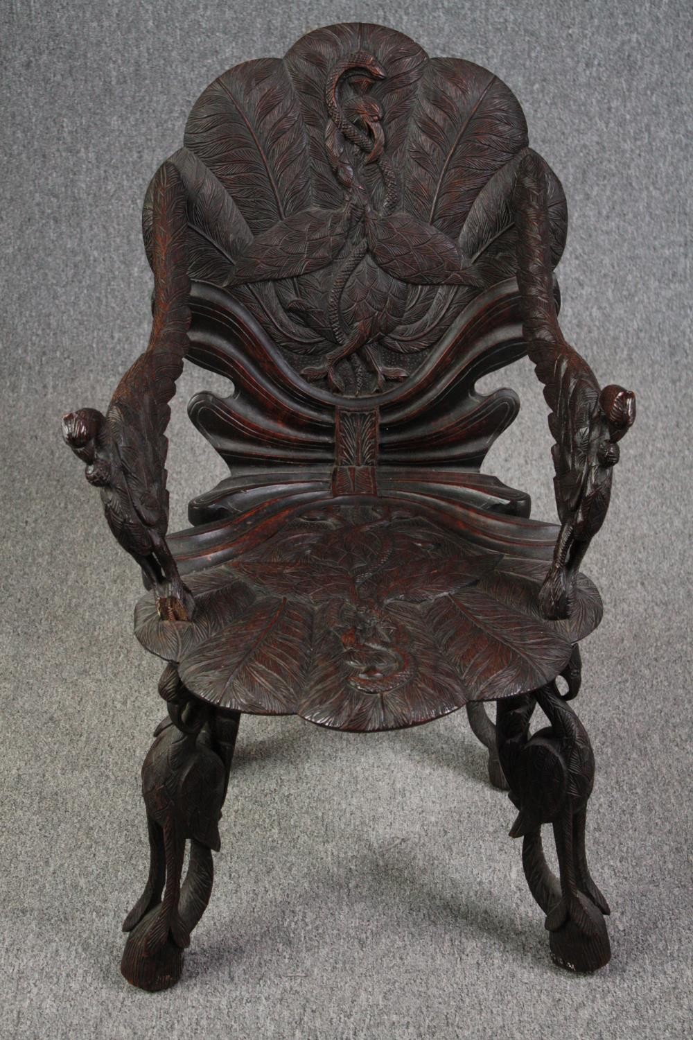 Grotto chair, 19th century Venetian style with allover bird and foliate carving. H.87cm.