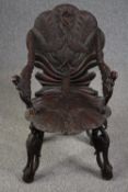 Grotto chair, 19th century Venetian style with allover bird and foliate carving. H.87cm.