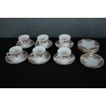 A Colclough six person coffee set with stylised floral design and gilded edging. Dia.15cm. (largest)