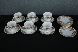 A Colclough six person coffee set with stylised floral design and gilded edging. Dia.15cm. (largest)
