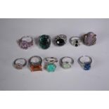 A collection of ten silver gem-set rings of various designs. Set with Blue topaz, Turquoise,