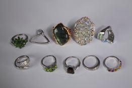 A collection of ten silver gem-set rings of various designs. Set with peridot, Labradorite, amethyst