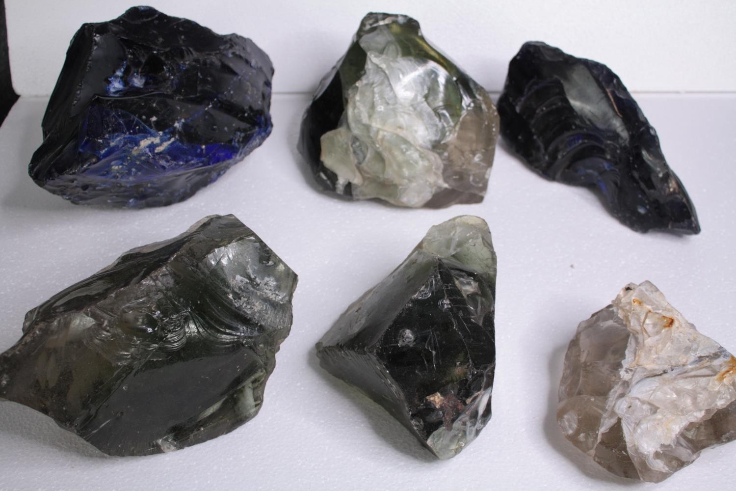 Six large pieces of slag glass, various colours. H.17 W.27cm. (largest)