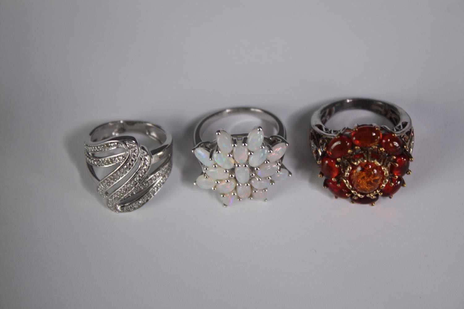 A collection of ten silver gem-set rings of various designs. Set with amber, opal, amethyst and - Image 2 of 4