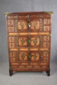 Tall cabinet, Chinese elm with allover applied brass decoration and banding. H.160 W.109 D.37cm. (