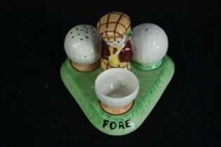 An unusual vintage Crown Devon cruet set of golfing interest. H.9 W.12 D.12cm.