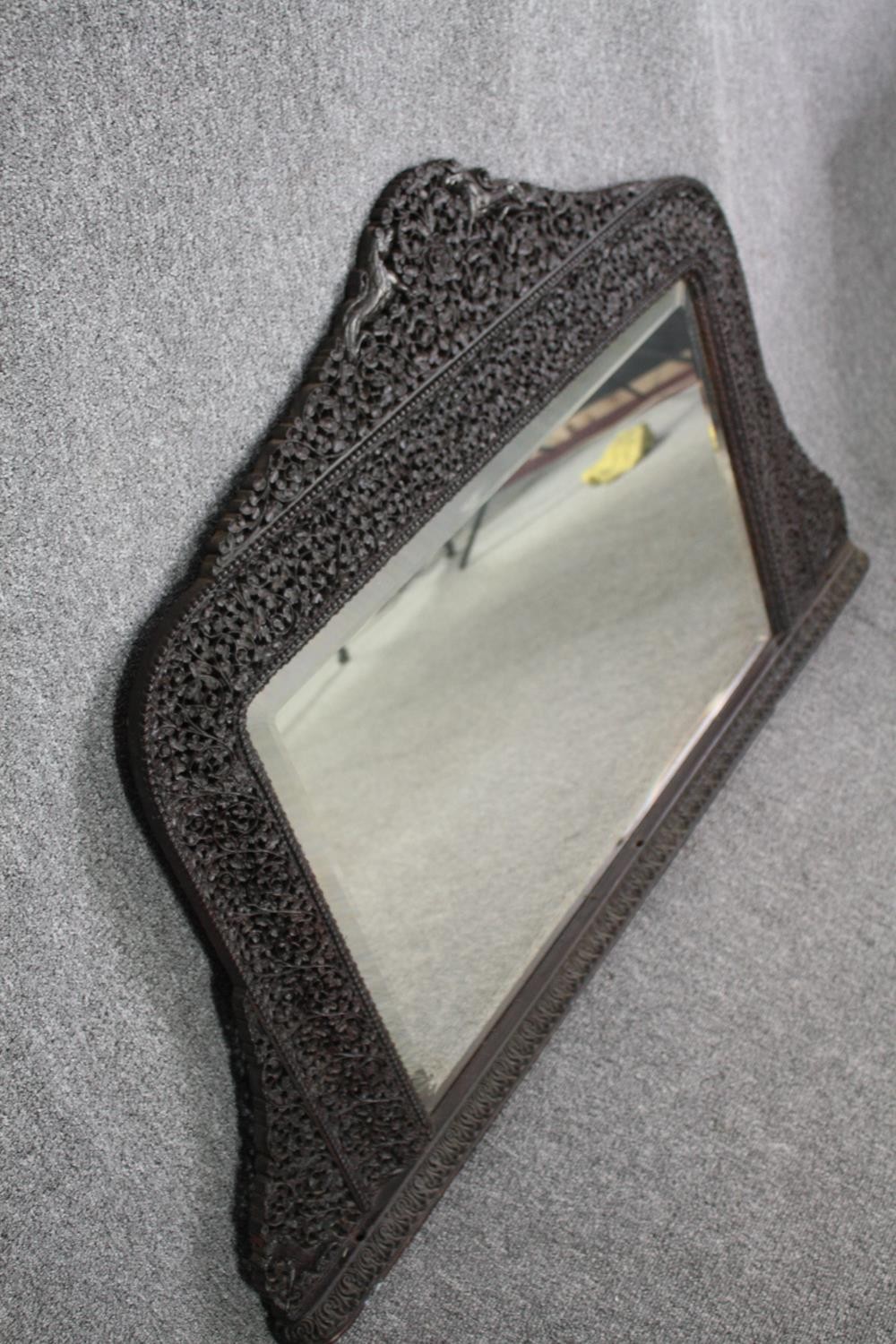 Over mantle carved Burmese hardwood mirror. H.80 W.127cm. - Image 3 of 4