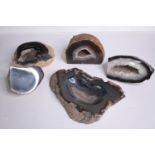 A collection of four Agate geodes and geode slices along with a carved agate ashtray. H.27 W.