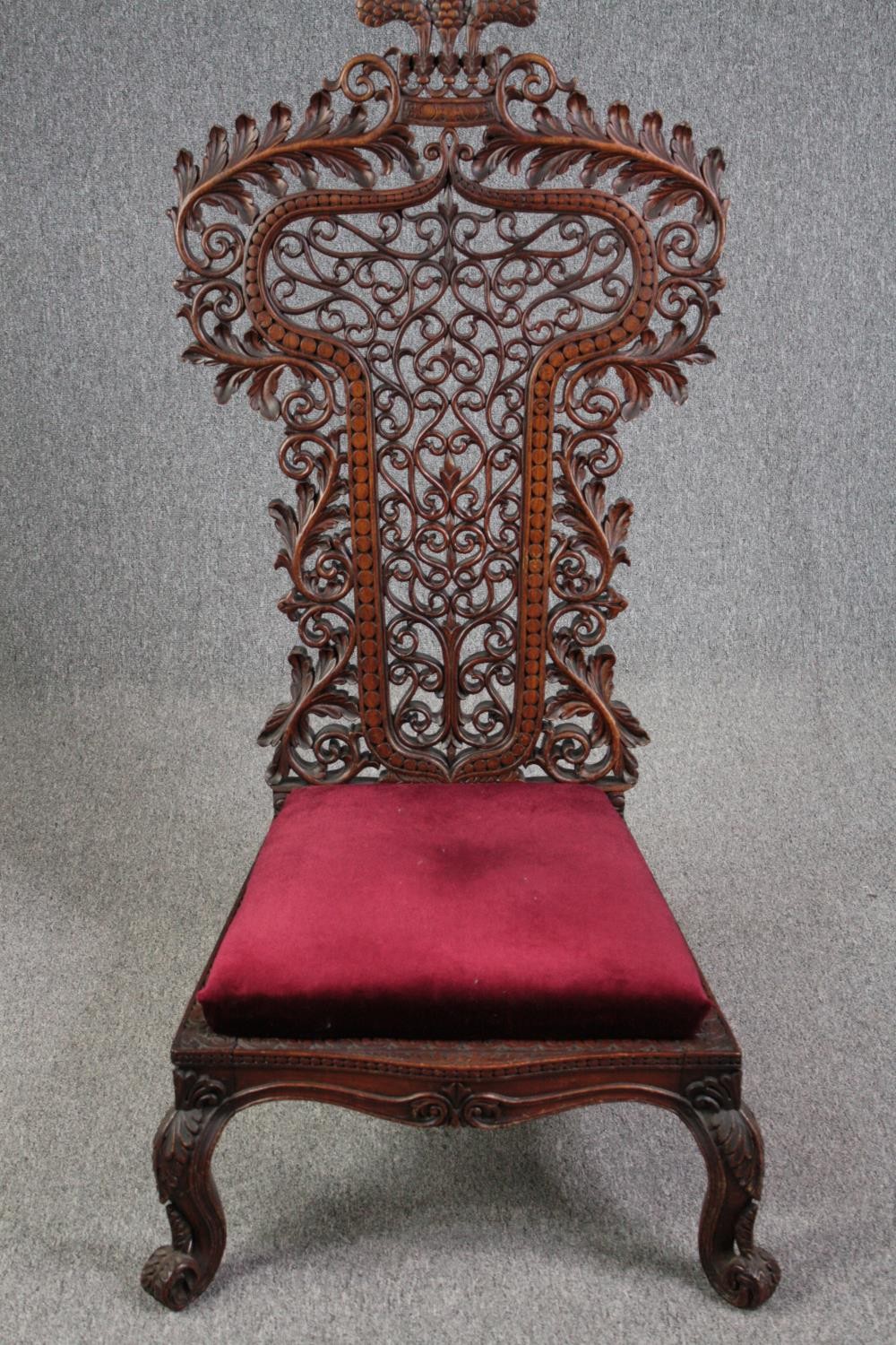 Side chair, 19th century Burmese carved hardwood. H.128cm.