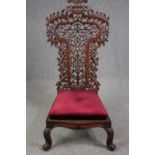 Side chair, 19th century Burmese carved hardwood. H.128cm.