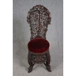 Side chair, 19th century Burmese carved hardwood. H.101cm.