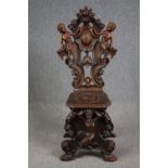 Hall chair, 19th century Italian Sgabello, carved walnut. H.123cm.