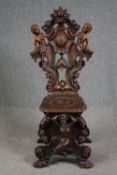 Hall chair, 19th century Italian Sgabello, carved walnut. H.123cm.