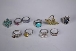 A collection of ten silver gem-set rings of various designs. Set with peridot, Turquoise, amethyst